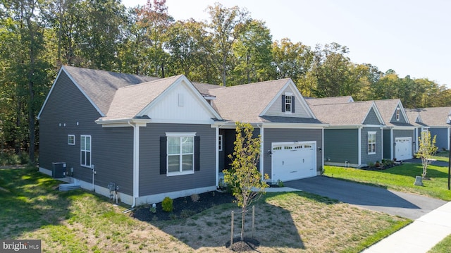 view of front of house featuring a front lawn and central air condition unit