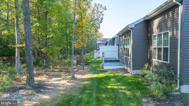 view of yard with a wooden deck