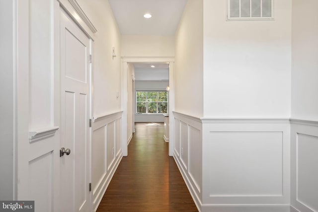 corridor with dark wood-type flooring