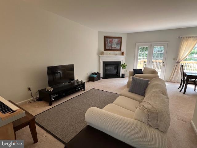 living room featuring light colored carpet