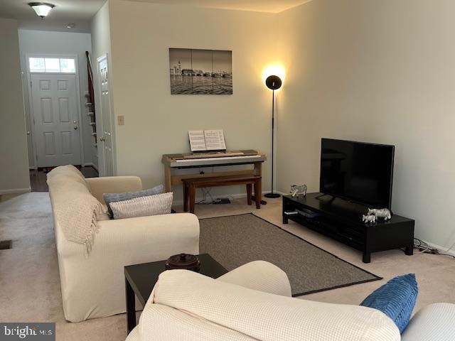 living room featuring light colored carpet