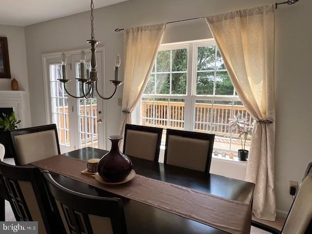 dining area featuring an inviting chandelier