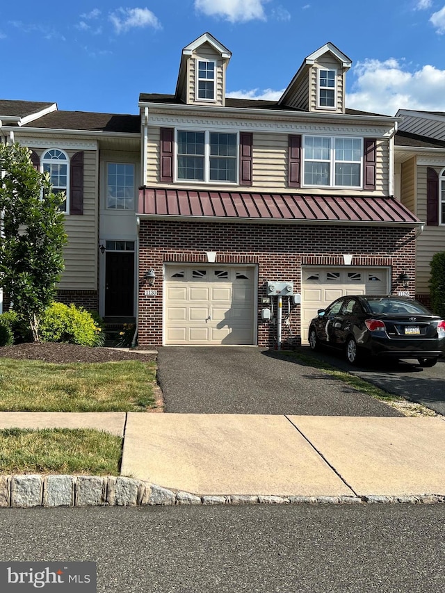 view of front of property with a garage