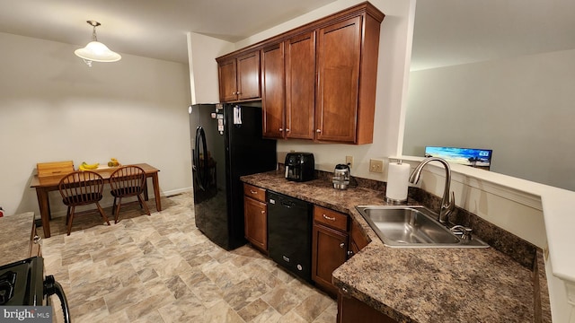 kitchen with black appliances, sink, and hanging light fixtures