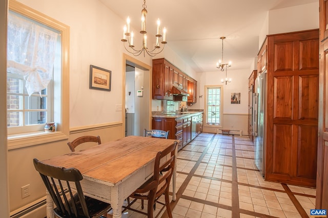 dining room with light tile patterned floors, an inviting chandelier, and vaulted ceiling