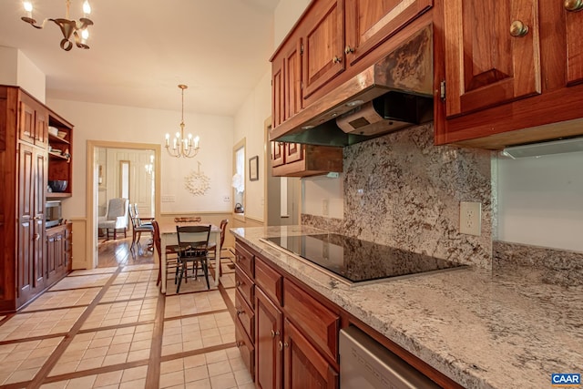 kitchen with a chandelier, black electric cooktop, decorative light fixtures, light stone countertops, and light tile patterned floors