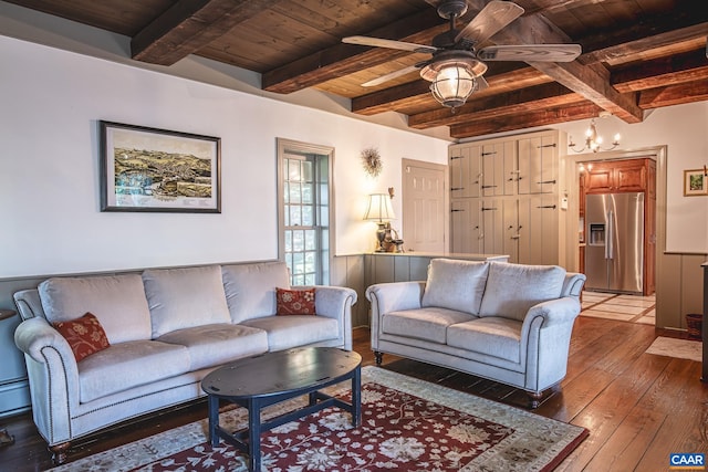 living room with beamed ceiling, ceiling fan, hardwood / wood-style floors, and wooden ceiling