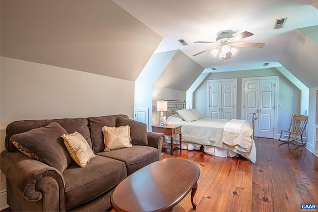 bedroom with ceiling fan, hardwood / wood-style flooring, and lofted ceiling