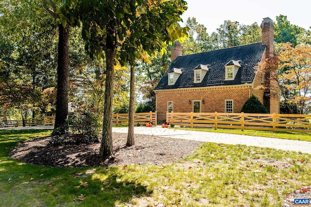 view of home's exterior with a lawn