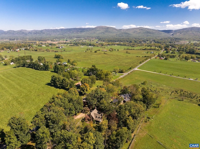 drone / aerial view with a mountain view and a rural view