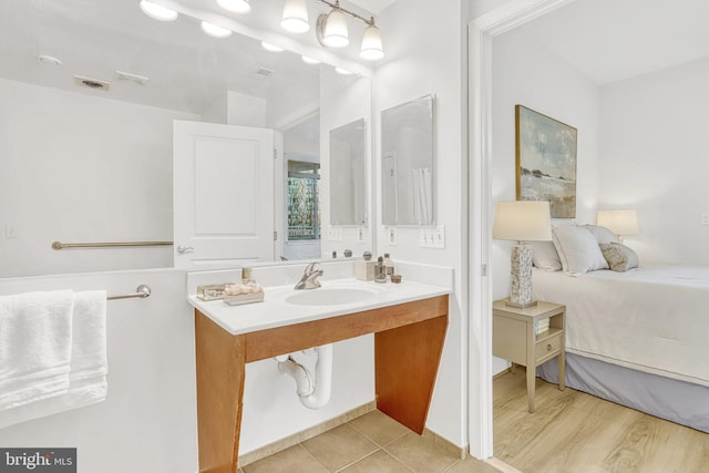 bathroom featuring sink and wood-type flooring