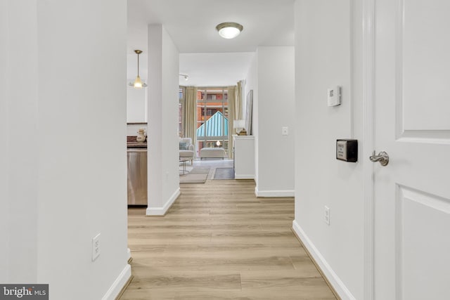 hallway with light wood-type flooring