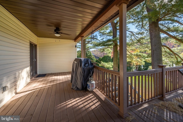 deck with a grill and ceiling fan