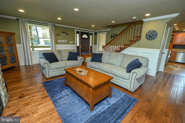 living room featuring ornamental molding, a textured ceiling, and dark hardwood / wood-style flooring