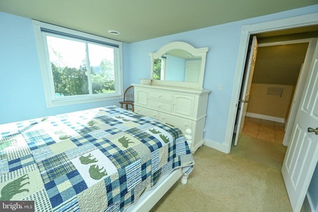 bedroom with light colored carpet