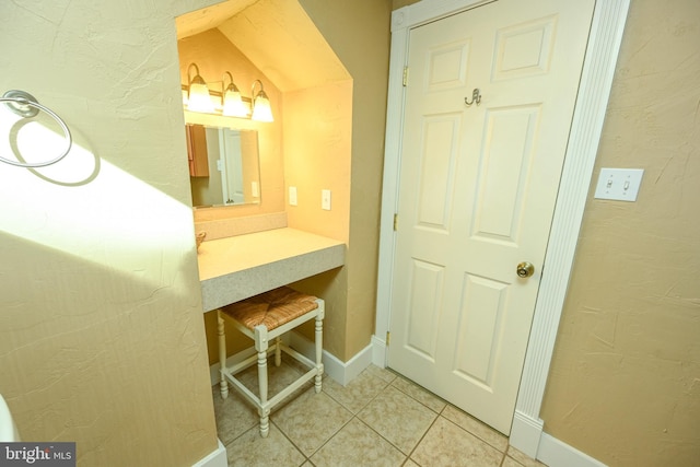 bathroom with tile patterned floors