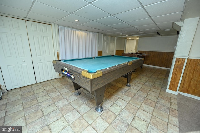 playroom featuring pool table, a paneled ceiling, and wooden walls