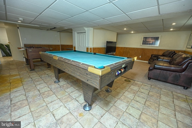 recreation room featuring a drop ceiling, wooden walls, and billiards