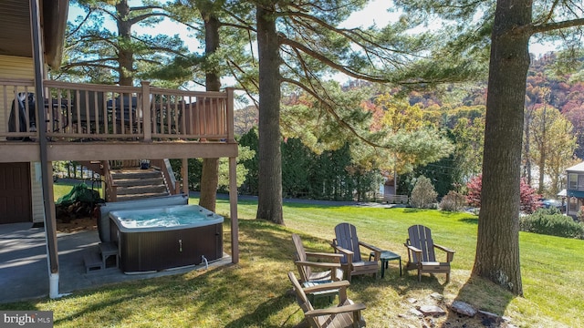 view of yard featuring a hot tub and a deck