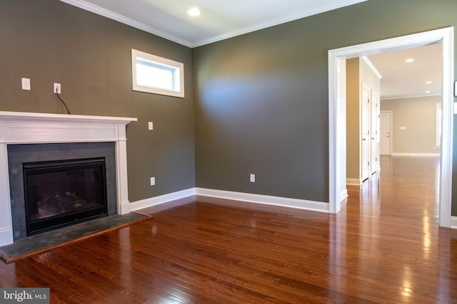 unfurnished living room with hardwood / wood-style flooring and ornamental molding