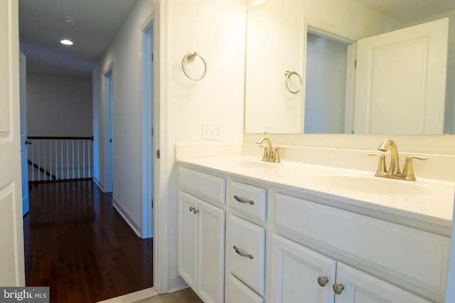 bathroom with vanity and wood-type flooring