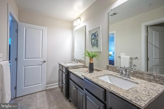 bathroom featuring vanity and tile patterned flooring