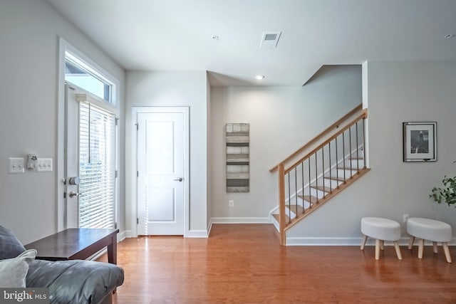 foyer entrance with hardwood / wood-style floors