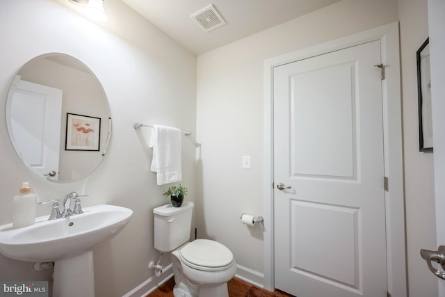 bathroom featuring sink and toilet