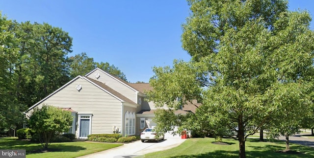 view of property exterior with a lawn