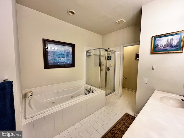 bathroom featuring vanity, separate shower and tub, and tile patterned floors