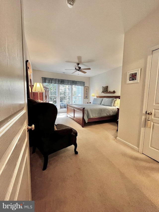 carpeted bedroom with ceiling fan