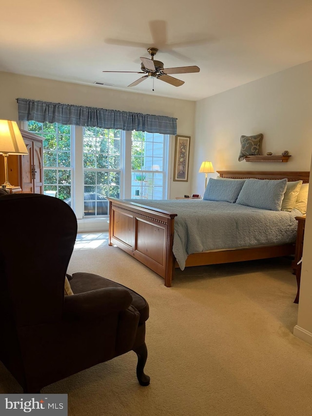 carpeted bedroom featuring ceiling fan