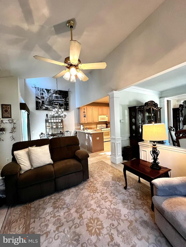 living room featuring ceiling fan and lofted ceiling