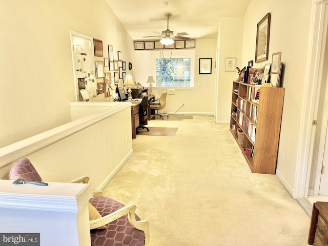 office area featuring light carpet, ceiling fan, and lofted ceiling