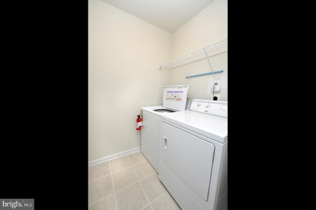 washroom with washer and dryer