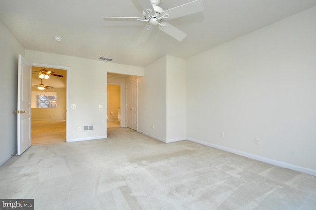 unfurnished bedroom featuring ceiling fan and light colored carpet