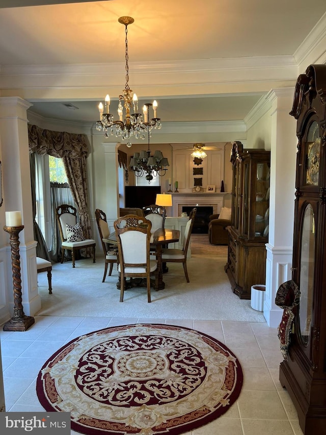 dining space with crown molding, light tile patterned floors, and a chandelier