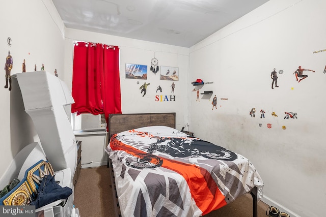 bedroom with cooling unit and carpet floors