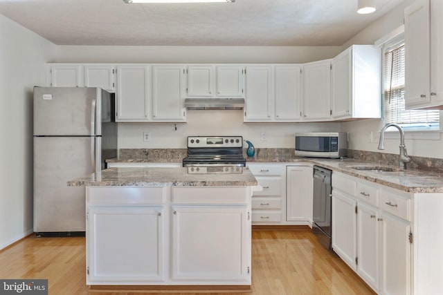 kitchen with white cabinets, appliances with stainless steel finishes, and sink