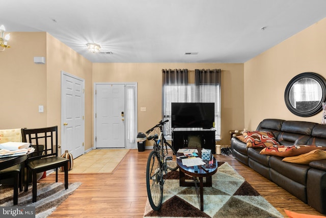 living room with light hardwood / wood-style flooring