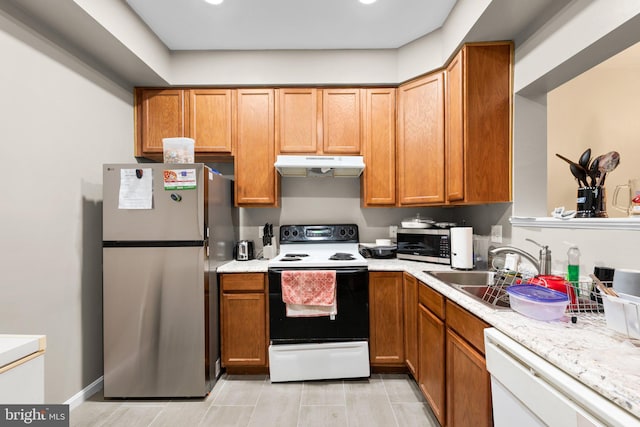 kitchen with sink and appliances with stainless steel finishes