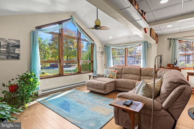 living room featuring baseboard heating, ceiling fan, light wood-type flooring, and vaulted ceiling