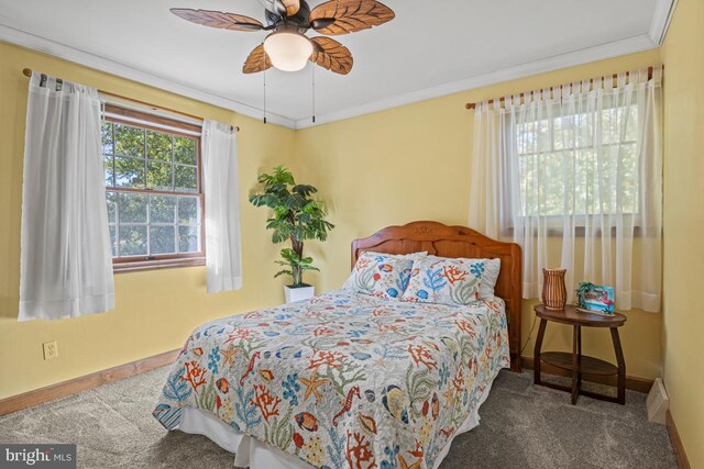 bedroom with ornamental molding, carpet flooring, and ceiling fan