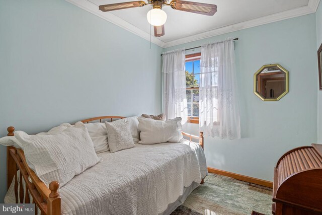 bedroom with ornamental molding and ceiling fan