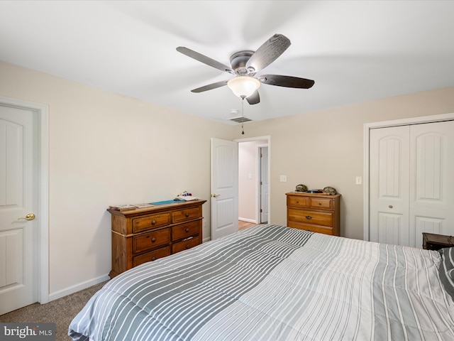 carpeted bedroom with a closet and ceiling fan