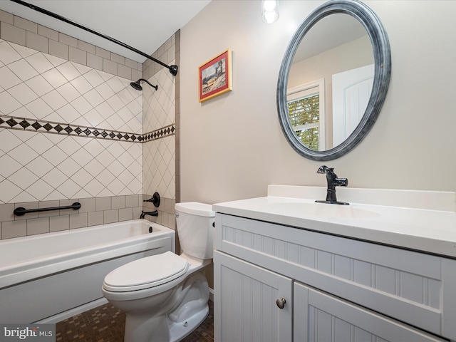 full bathroom featuring vanity, toilet, and tiled shower / bath