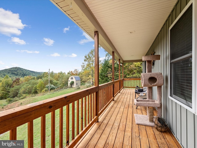 wooden deck featuring a mountain view