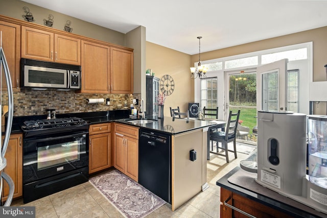 kitchen featuring black appliances, decorative backsplash, sink, a chandelier, and decorative light fixtures