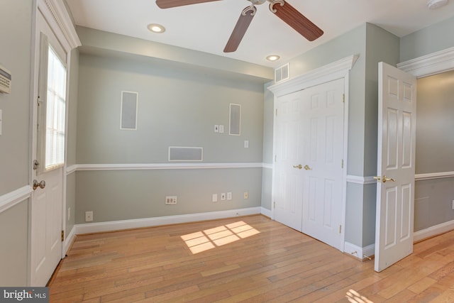 foyer entrance featuring light hardwood / wood-style flooring and ceiling fan