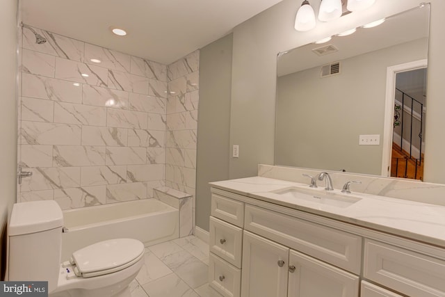 full bathroom with toilet, tiled shower / bath, and vanity